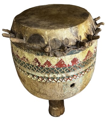 Lot 584 - A large African goblet drum with carved and...