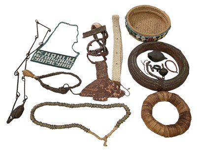 Lot 1059 - A collection of African tribal artefacts...