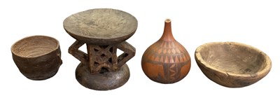 Lot 1060 - An African carved hardwood stool, probably...