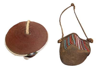 Lot 1079 - An African beaded hat and a bag with beaded...