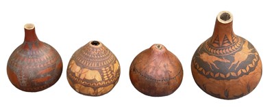 Lot 1082 - Three African gourd vases with incised...