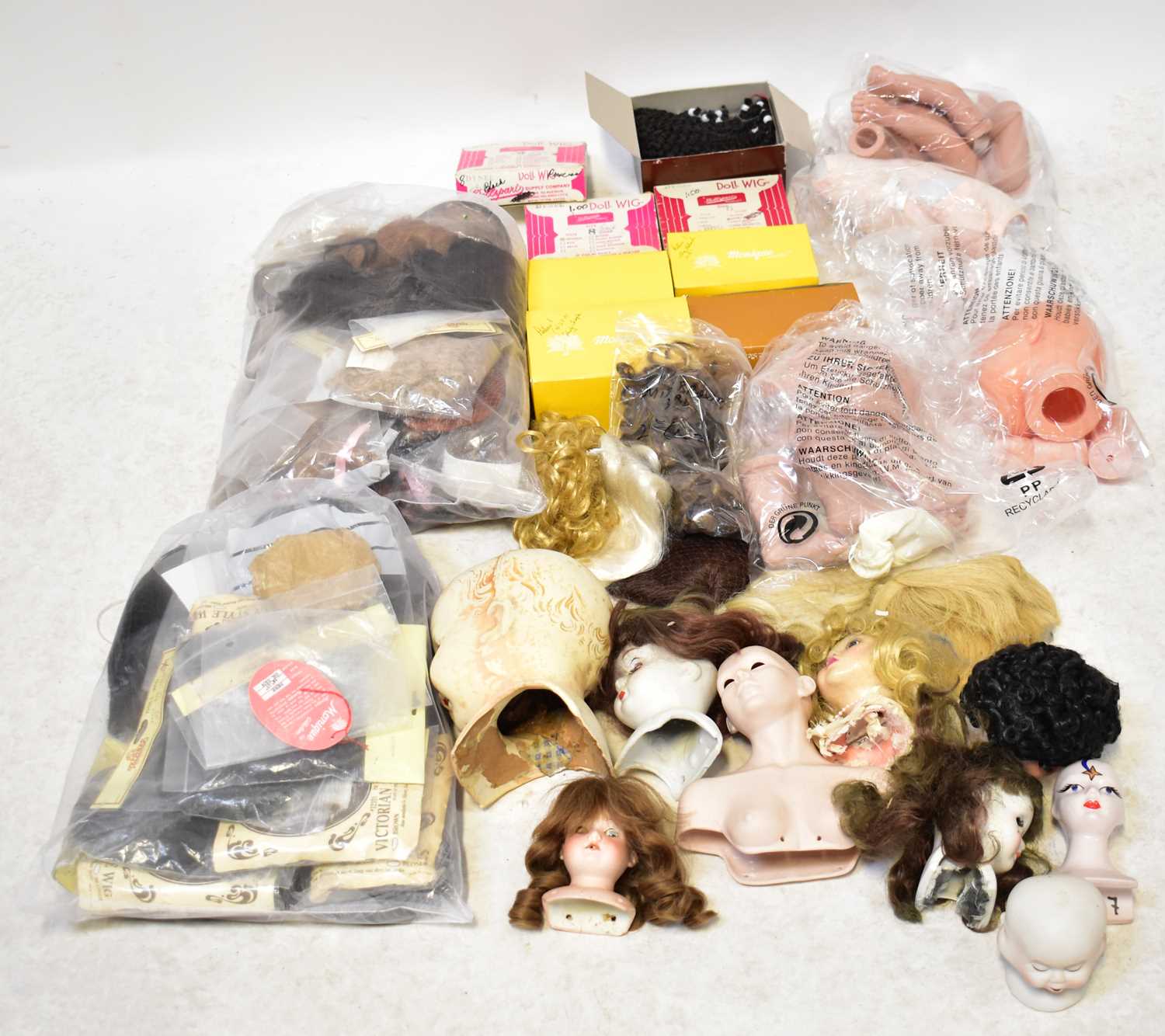 Lot 745 - A large quantity of dolls' wigs, to include...