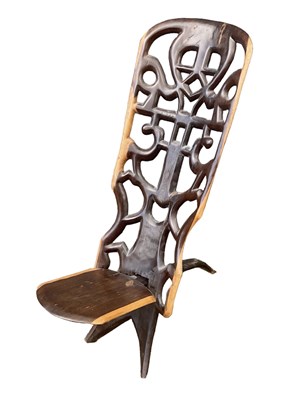 Lot 1089 - An African carved hardwood birthing chair.