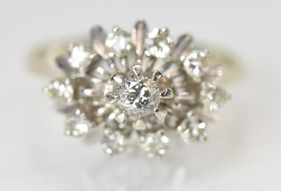 Lot 1274 - A 14ct white gold and diamond set cluster ring,...