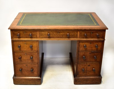 Lot 23 - An early 20th century oak pedestal desk with...
