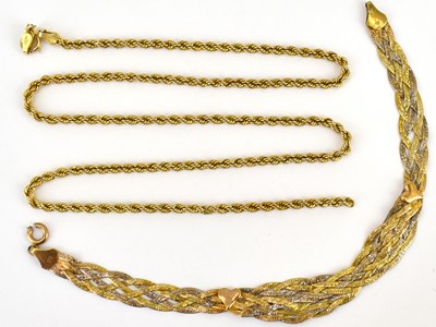 Lot 1115 - A 9ct gold braided bracelet with ring clasp,...