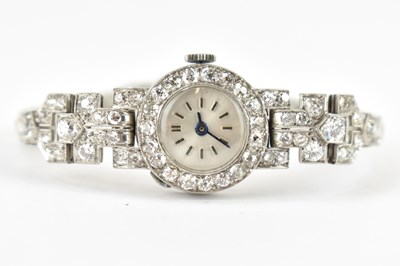 Lot 1217 - A ladies' Art Deco diamond encrusted platinum...