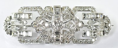 Lot 1056 - An Art Deco brooch with white metal mount, set...