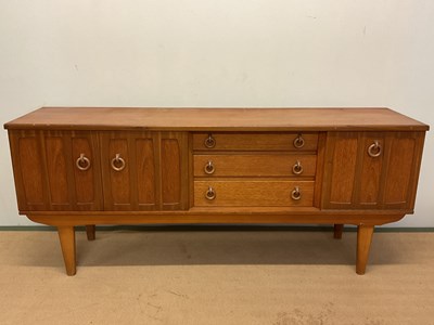 Lot 720 - STONEHILL; a mid 20th century teak sideboard,...