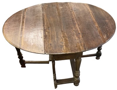 Lot 53 - An 18th century oak drop-leaf gateleg table...