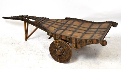 Lot 1519 - An Anglo-Indian brass mounted two wheeled cart,...