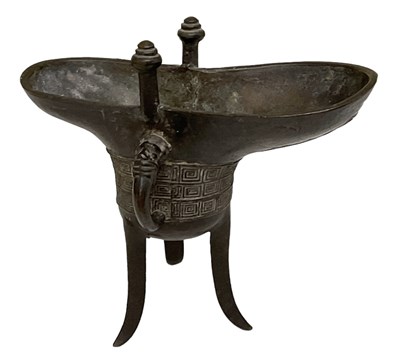 Lot 1005 - An 18th century archaistic bronze tripod...