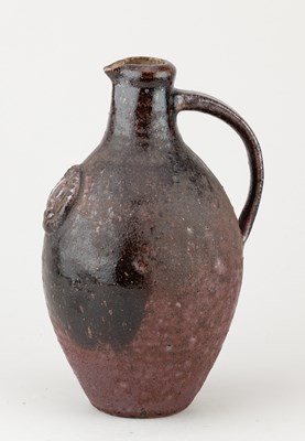 Lot 729 - A stoneware flagon with applied medallion...