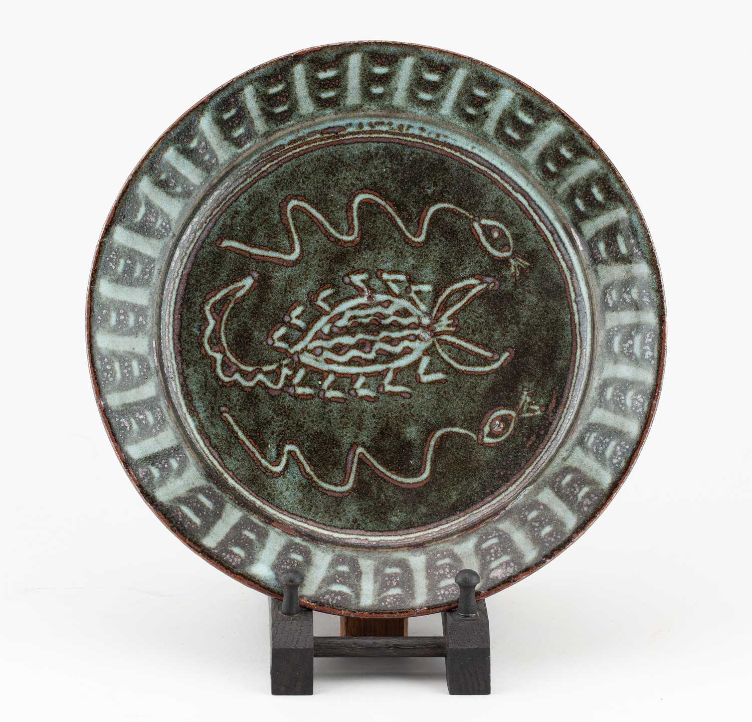 Lot 429 - Abuja Pottery; a stoneware plate covered in...