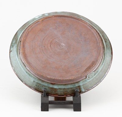 Lot 429 - Abuja Pottery; a stoneware plate covered in...
