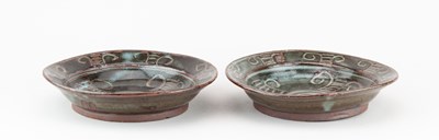 Lot 426 - Abuja Pottery; a near pair of stoneware dishes...