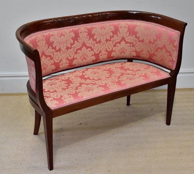 Lot 1166 - An Edwardian style mahogany settee with carved...