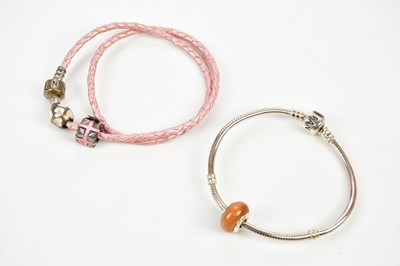 Lot 882 - PANDORA; a silver charm rope bracelet with...