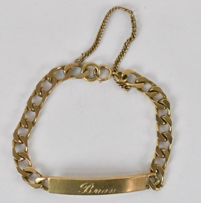 Lot 1258 - A 9ct yellow gold Cuban link identity bracelet,...