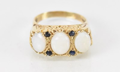 Lot 1285 - A 9ct yellow gold opal and sapphire set ring,...