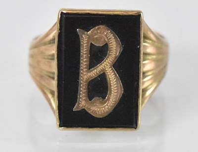 Lot 1313 - A 9ct yellow gold onyx set identity ring,...