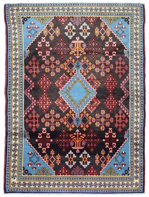 Lot 78 - A Persian woollen carpet with red, blue and...