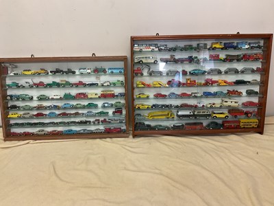 Lot 207 - Two glazed cabinets of diecast model vehicles,...