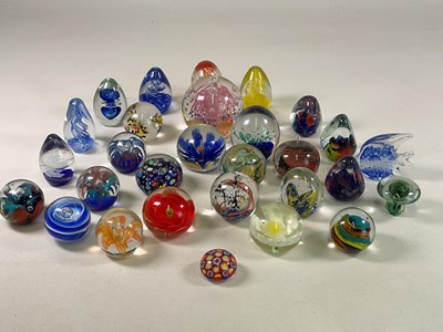 Lot 329 - A collection of glass paperweights.