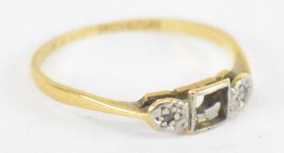 Lot 1365 - An 18ct yellow gold and platinum three stone...