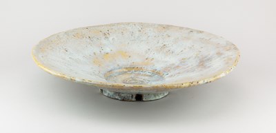 Lot 680 - A large flared stoneware bowl covered in...