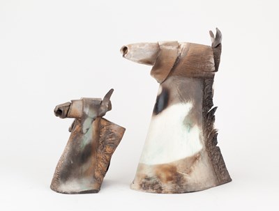 Lot 687 - A smoke fired earthenware sculpture of a horse'...