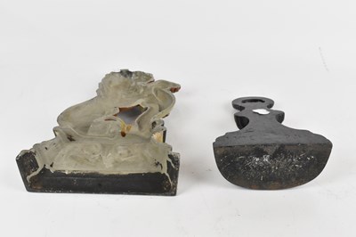 Lot 179 - A 19th century cast iron door stop with loop...