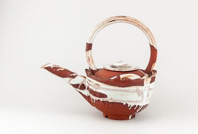 Lot 5 - ADAM TOBIN; a large red stoneware teapot...