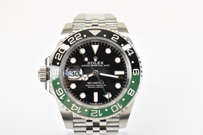 Lot 1433 - ROLEX; a stainless steel GMT-Master II left...