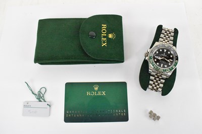 Lot 1433 - ROLEX; a stainless steel GMT-Master II left...