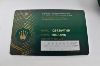 Lot 1433 - ROLEX; a stainless steel GMT-Master II left...