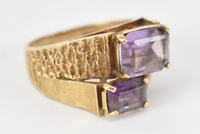 Lot 1283 - A 9ct yellow gold amethyst set dress ring,...