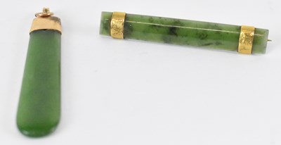 Lot 1366 - A nephrite jade pendant with 9ct gold mount,...