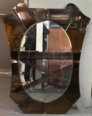 Lot 6 - An Art Deco oval glass mirror, with peach...