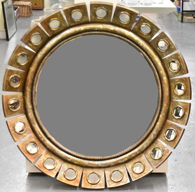 Lot 17 - A modern circular wall mirror, the frame set...