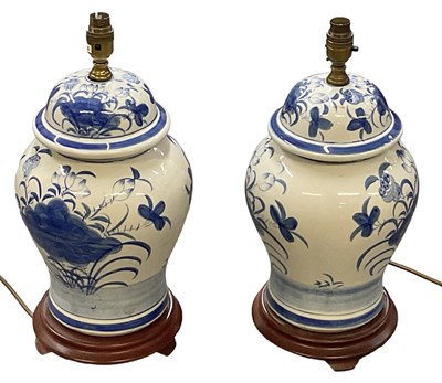 Lot 94 - A pair of modern blue and white temple jars...