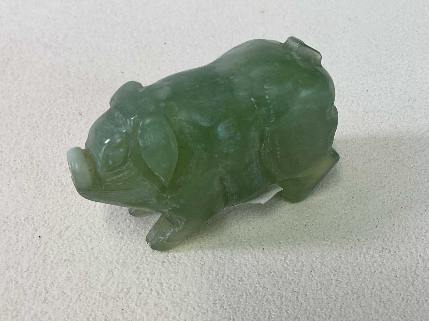 Lot 267 - A Chinese carved jade figure of a pig, length...