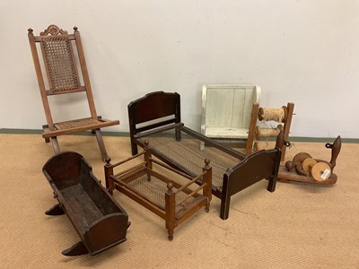 Lot 232 - A collection of doll's furniture including a...