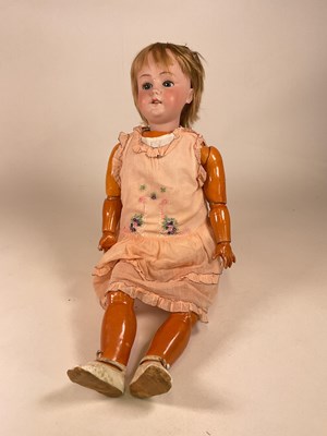 Lot 184 - A bisque head doll, with brown sleeping eyes...