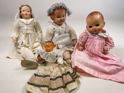 Lot 215 - A collection of mid century and 1930s dolls,...