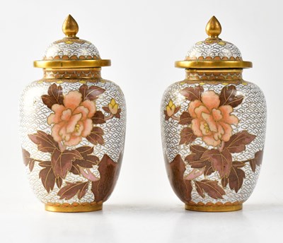 Lot 142 - A pair of 20th century enamelled lidded vases,...