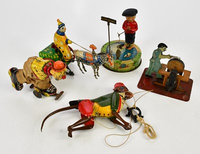 Lot 298 - A small collection of tinplate toys including...