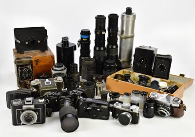 Lot 517 - A collection of cameras and lenses, to include...