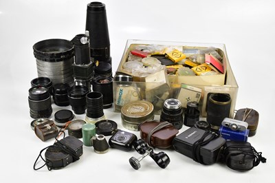 Lot 518 - A collection of lenses and lens accessories,...