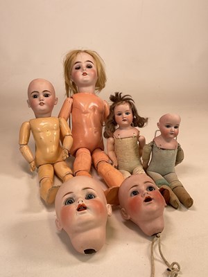 Lot 213 - A collection of bisque dolls and heads for...